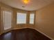 Sunlit breakfast area with wood floors and multiple windows at 287 Bramlett Meadows Dr, Douglasville, GA 30134