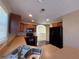 Open kitchen layout with wood cabinets and modern appliances, connecting to a breakfast area at 287 Bramlett Meadows Dr, Douglasville, GA 30134
