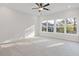 Spacious bedroom with carpeted floors and bright windows, providing ample natural light at 937 Willingham Dr # 7, Hapeville, GA 30354