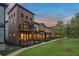 Stunning townhomes with brick and siding, balconies, and lush green landscaping at 937 Willingham Dr # 7, Hapeville, GA 30354