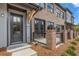 Charming townhome with a brick facade, covered front porch, and manicured landscaping at 937 Willingham Dr # 7, Hapeville, GA 30354