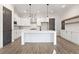 Modern kitchen with white cabinets, a large island, and stainless steel appliances at 937 Willingham Dr # 7, Hapeville, GA 30354