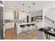 Open kitchen with an island, stylish bar stools, and stainless steel appliances at 937 Willingham Dr # 7, Hapeville, GA 30354