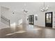 Bright living room with wood floors, large windows, and modern ceiling fan at 937 Willingham Dr # 7, Hapeville, GA 30354