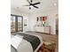 Spacious main bedroom features a ceiling fan, ensuite bathroom, and lots of natural light through the windows at 937 Willingham Dr # 7, Hapeville, GA 30354