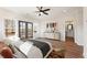 Spacious main bedroom features a ceiling fan, ensuite bathroom, and lots of natural light through the windows at 937 Willingham Dr # 7, Hapeville, GA 30354