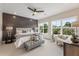 Serene bedroom with feature wall, plush bedding, and large windows with scenic views at 941 Willingham Dr # 5, Hapeville, GA 30354