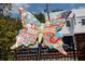 Hapeville butterfly art installation featuring colorful designs, patterns and text against a bright, sunny outdoor backdrop at 941 Willingham Dr # 5, Hapeville, GA 30354