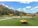 Charming neighborhood park with picnic tables, play structures, and lush greenery, creating a welcoming outdoor space at 941 Willingham Dr # 5, Hapeville, GA 30354