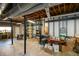 Unfinished basement with exposed beams, structural posts, and a door to the outside at 2112 Starfire Ne Dr, Atlanta, GA 30345