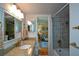 Stylish bathroom with granite countertop, modern fixtures, and a shower-tub combination at 2112 Starfire Ne Dr, Atlanta, GA 30345