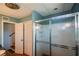 Bathroom with a shower and glass doors, view to the stairs, and closet at 2112 Starfire Ne Dr, Atlanta, GA 30345
