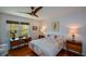 Bright and cozy bedroom featuring hardwood floors, a modern ceiling fan, and ample natural light at 2112 Starfire Ne Dr, Atlanta, GA 30345