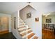Inviting entryway with hardwood stairs, slate flooring, and access to multiple rooms at 2112 Starfire Ne Dr, Atlanta, GA 30345