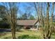 Charming single-story home featuring a well-manicured lawn, mature trees, and inviting front entrance at 2112 Starfire Ne Dr, Atlanta, GA 30345
