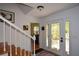 Bright foyer with staircase, a decorative glass front door, and neutral wall paint at 2112 Starfire Ne Dr, Atlanta, GA 30345