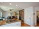 Open concept kitchen with granite counters, brick fireplace, and view to dining area at 2112 Starfire Ne Dr, Atlanta, GA 30345