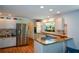 Sunlit kitchen with granite counters, stainless appliances, and breakfast bar at 2112 Starfire Ne Dr, Atlanta, GA 30345