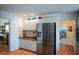 Bright kitchen boasts stainless steel refrigerator, warm wood floors, and lots of cabinet space at 2112 Starfire Ne Dr, Atlanta, GA 30345