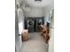 Bright laundry room with stainless steel washer and dryer, storage cabinets, and tile floors at 2112 Starfire Ne Dr, Atlanta, GA 30345