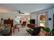 Inviting living room boasts hardwood floors, a ceiling fan, natural light and comfortable seating at 2112 Starfire Ne Dr, Atlanta, GA 30345