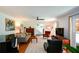 Bright living room features hardwood floors, a ceiling fan, and natural light through large windows at 2112 Starfire Ne Dr, Atlanta, GA 30345