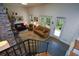 Bright living room with large windows, a brick fireplace, and comfortable seating at 2112 Starfire Ne Dr, Atlanta, GA 30345