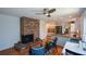 Open living area with brick fireplace flows into bright kitchen with stainless appliances at 2112 Starfire Ne Dr, Atlanta, GA 30345
