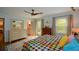Bright bedroom with hardwood floors, dresser, and access to a private balcony at 2112 Starfire Ne Dr, Atlanta, GA 30345