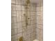 Close up of modern shower featuring rainfall showerhead and eye-catching patterned tiles at 2112 Starfire Ne Dr, Atlanta, GA 30345