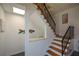Unique staircase design featuring wooden steps, black railings, and a quirky fish decoration for added charm at 2112 Starfire Ne Dr, Atlanta, GA 30345