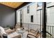 Cozy outdoor balcony with comfortable seating, overlooking the exterior building at 219 Howell Se Dr # A, Atlanta, GA 30316