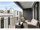 Inviting outdoor balcony features stylish seating with wicker furniture and a cozy gray rug at 219 Howell Se Dr # A, Atlanta, GA 30316
