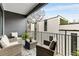Cozy outdoor seating area on balcony with gray wicker furniture and geometric rug, perfect for relaxing at 219 Howell Se Dr # A, Atlanta, GA 30316