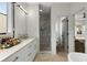This bright bathroom offers a double vanity, glass shower, and easy access to the walk-in closet and bedroom at 219 Howell Se Dr # A, Atlanta, GA 30316