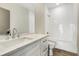 The modern bathroom has a sleek vanity, large mirror, and tile shower/tub combo at 219 Howell Se Dr # A, Atlanta, GA 30316
