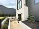Private front courtyard with stylish outdoor seating area and manicured landscaping at 219 Howell Se Dr # A, Atlanta, GA 30316
