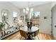 Cozy dining room features modern lighting fixtures, a wooden dining table, and contemporary decor at 219 Howell Se Dr # A, Atlanta, GA 30316