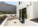 Charming entrance with outdoor seating in a small courtyard with black mulch and pruned trees at 219 Howell Se Dr # A, Atlanta, GA 30316