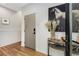 Entryway features hardwood floors, white walls, a console table with decor, and a horse portrait above it at 219 Howell Se Dr # A, Atlanta, GA 30316
