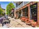 Charming storefront featuring red brick, black framed windows, and patio seating at 219 Howell Se Dr # A, Atlanta, GA 30316