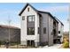 Striking modern home with a two-tone exterior, dark trim, and a well-manicured front yard in a desirable neighborhood at 219 Howell Se Dr # A, Atlanta, GA 30316