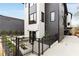Contemporary home featuring two-tone exterior, manicured landscape, and a black metal fence at 219 Howell Se Dr # A, Atlanta, GA 30316