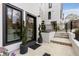 Stylish modern entrance with black framed windows, a glass door and manicured potted plants at 219 Howell Se Dr # A, Atlanta, GA 30316
