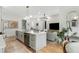 Open concept kitchen and living space with sleek appliances, a center island, and contemporary decor at 219 Howell Se Dr # A, Atlanta, GA 30316