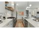 Modern kitchen with stone countertops, stainless steel appliances, and elegant lighting fixtures at 219 Howell Se Dr # A, Atlanta, GA 30316