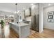 Spacious kitchen boasts a large center island, stainless steel appliances, and gray custom cabinetry at 219 Howell Se Dr # A, Atlanta, GA 30316