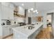 Bright, spacious kitchen boasts white cabinetry, marble backsplash, and a large island with clear seating at 219 Howell Se Dr # A, Atlanta, GA 30316