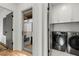 Convenient laundry room with modern washer and dryer units with access to a balcony at 219 Howell Se Dr # A, Atlanta, GA 30316
