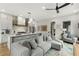Inviting open-concept with a gray sectional sofa, kitchen and connecting living area with natural light at 219 Howell Se Dr # A, Atlanta, GA 30316